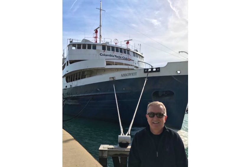 Thomas O’Grady had a passerby take his photo in 2017 in front of the MV Abegweit in Chicago, where it serves as the floating clubhouse of the Columbia Yacht Club.