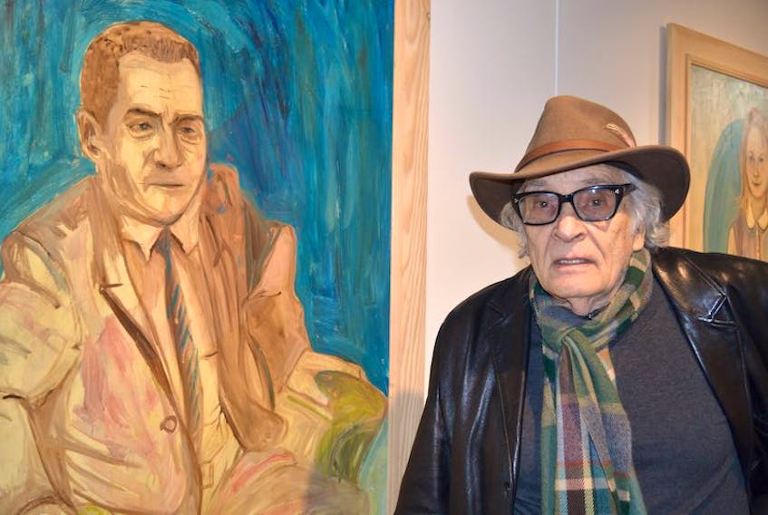 Gerard Clarkes stands next to one of his paintings that is being shown at the Confederation Centre Art Gallery in Charlottetown. The painting, an oil on board Clarkes did in 1962, is of newsman Arnold Barron.