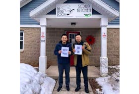 Yikun Zheng and Yan Liu are shown in front of the soup kitchen in Charlottetown last month.