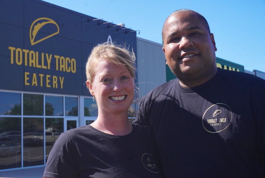 Tyson Clyke and Sherry Garnhum stand outside their new restaurant, Totally Taco Eatery, in Montague on Aug. 19.