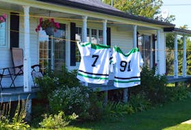 Hockey jerseys flutter on the line in the Rural Municipality of Northport Monday afternoon in support of the two teens, Ethan Reilly and Ryan Hutchinson, who capsized Sept. 16. Reilly's body has been recovered. The search for Hutchinson continues.
