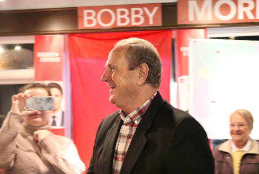 Liberal incumbent Bobby Morrissey is greeted by his supporters in Summerside after learning he will be returned to Ottawa as MP for Egmont after the Oct. 21 federal election.