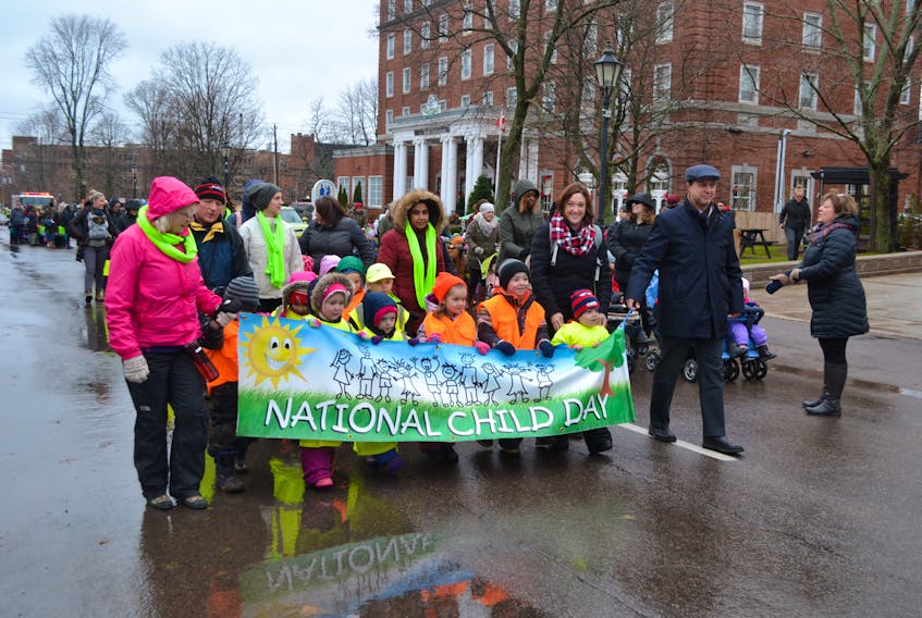 Children from the Tiny Tot Early Years Centre in Charlottetown join parade marshal Brad Trivers, right, education and lifelong learning minister, in leading the National Child Day Parade in Charlottetown on Wednesday. Hundreds of children and their teachers marched up Kent Street, turning onto Great George Street, finishing behind the George Coles Building to celebrate an important day. Nov. 20 marks a special celebration of the rights of all children including the rights to good health, good education, protection from harm, pride in their heritage beliefs and to be included. National Child Day Parades also took place in other P.E.I. communities including Summerside, Souris, Bloomfield and Tignish.