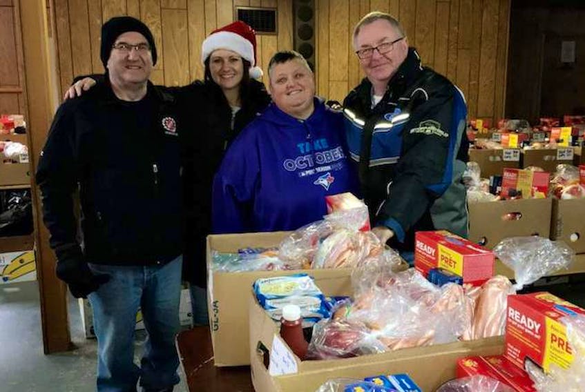 The Kin Family in Summerside, including, from left, co-chair Eric Ferrish, committee member Alesia Desjardins, co-chair Sue Gallant and co-chair Ray McCourt are looking forward to preparing this year’s packages for families in need. Anyone wishing to apply for a hamper is asked to contact Gallant at 902-303-0135 or email Desjardins at alesiadesjardins9@gmail.com.