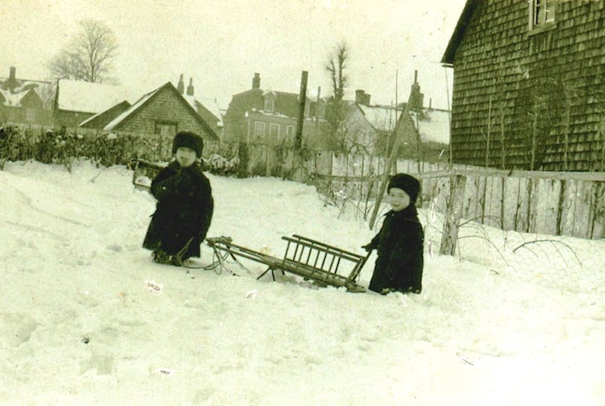 Like children today, these members of the Hennessey family in this photo, c. 1920, seem to have been able to make a toboggan hill out of the smallest drift of snow. If Santa brought a sled, then it would be well used, whether snow was 10 feet or two feet high. The photo, taken at 66 Rochford St., offers a good view of Pownal Street in the background, including 140 Pownal St. on the left and the back of the former Catholic Family Services building on the right. This is just one of the images and artifacts that is part of the pop-up exhibit, Happy Holidays, available for viewing on the first floor of the Confederation Court Mall until Jan. 8. Francis P. Hennessey and Stella M. Mullen Collection, City of Charlottetown Archives
