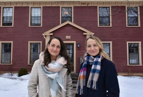 Melody McInnis and her sister, Krista Stevenson stand in front of the seven-unit long-term rental property Stevenson and her husband own at 185 King St. in Charlottetown. McInnis also owns a six-unit rental property in downtown Charlottetown with her husband. - Michael Robar