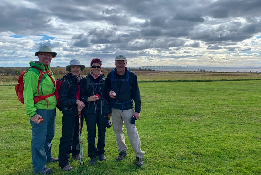 Bryson Guptill, right, enjoys a scenic break on his 704-kilometre walk around P.E.I. with Dan Grant, left, Nora Wotton and Marion Grant in October 2019.
