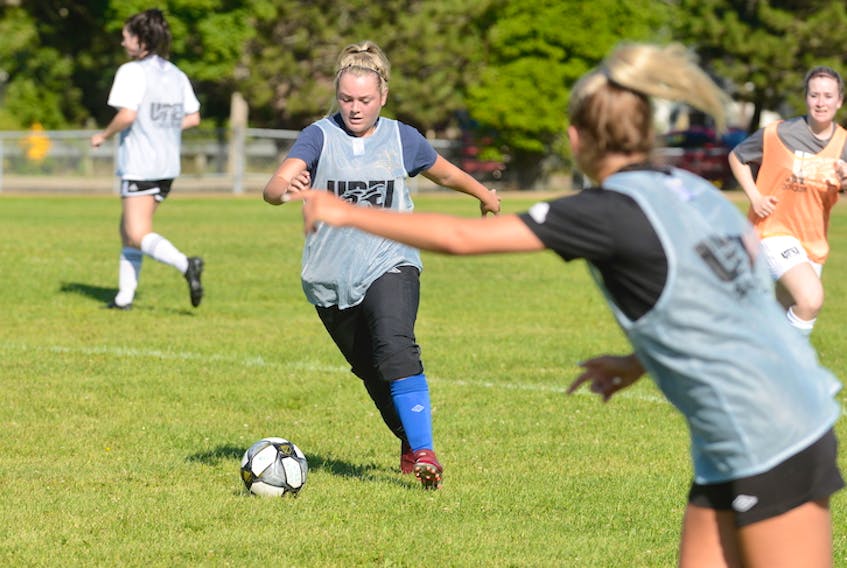 Caitlyn McCloskey, foreground, calls for Hillary Younker to send the ball to her during Saturday’s UPEI Panthers’ women’s soccer team training camp.