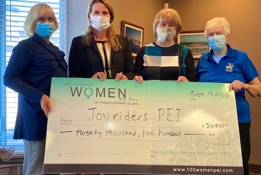 Aileen Matters and Cheryl Paynter from 100 Women Who Care, join Janice Cole, past president, and Daphne Davey, president  from Joyriders P.E.I.