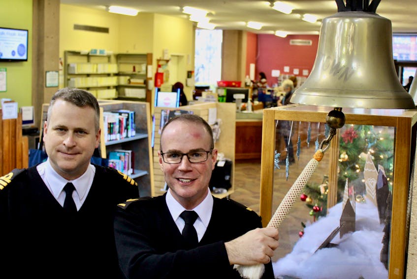 Members of HMCS Charlottetown visited the ship's namesake city to meet with the community, Dec. 20-22. Pictured are commanding officer Chris Rochon, left, and leading seaman Mike MacKinnon at the Confederation Centre Public Library where a bell from the former HMCS Charlottetown II now rests. The 25th anniversary of the current HMCS Charlottetown's commissioning is next year on Sept. 9, 2020, which its crew members hope to acknowledge in some special way. "We're one of the few ships that actually got commissioned in our home city," Rochon said.