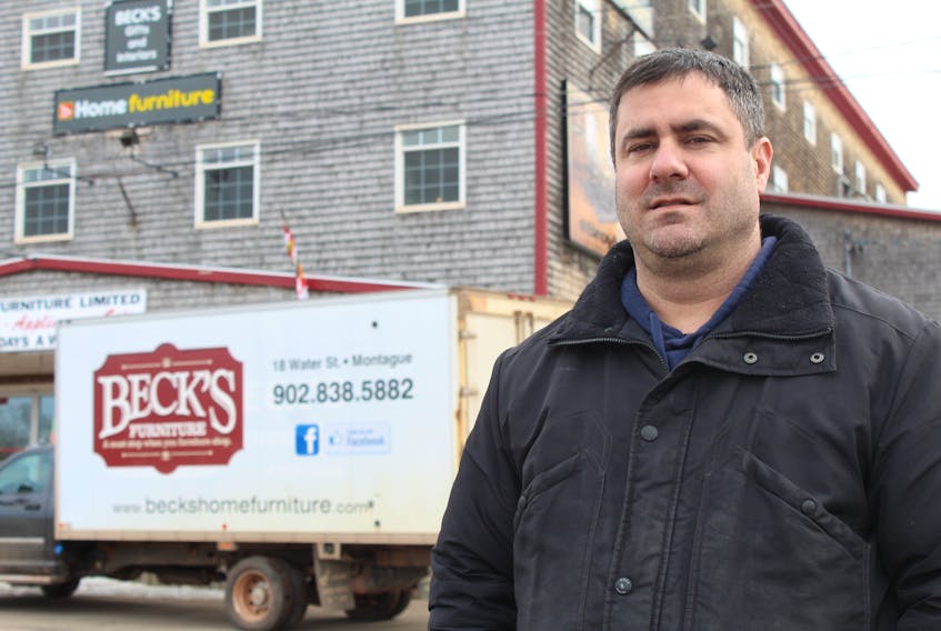 Jeff Beck, manager of Beck's Home Furniture and Appliances, stands outside his store in Montague on March 23.