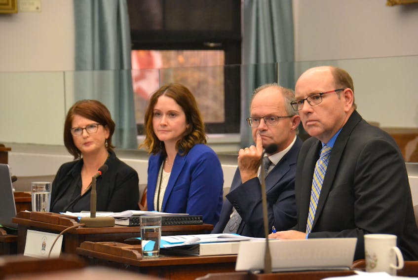 Representatives of the Department of Social Development and Housing, from left, Deborah Bradley, assistant deputy minister; Karen McCaffrey, director of social programs; Ernie Hudson, minister; and Patrick MacDonald, acting director of social programs take questions from Island MLAs during a standing committee meeting on Wednesday.