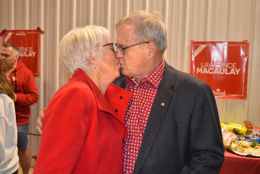 Lawrence and Frances MacAulay share a kiss after the Cardigan MP, who won for the 10th consecutive election Monday night, talked about how important his wife has been in his political career.