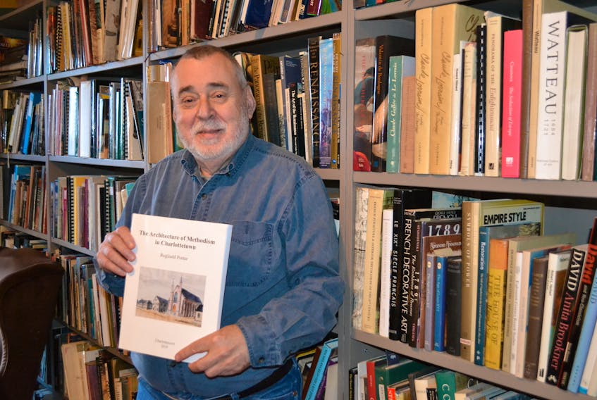 Reg Porter holds a copy of his new book, “The Architecture of Methodism in Charlottetown”, in the library of his Belle River home. The P.E.I. art historian will speak on Sunday, Nov. 24, 10:30 a.m., at the 155th anniversary service of Trinity United Church in Charlottetown.