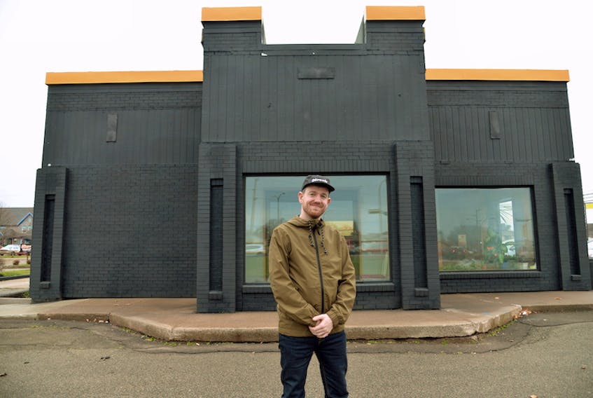 Bruce Rooney, general manager of Nimrods', stands in front of the newly painted former KFC building in Stratford. Nimrods' is planning to open a year-round restaurant at that spot the first week of December.