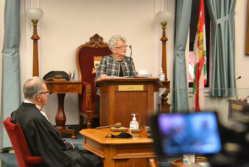 Lt.-Gov. Antoinette Perry (centre) reads the 2021 speech from the throne before the P.E.I. legislature. Seated at left is Speaker Colin LaVie.