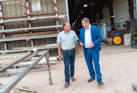 From left, CMP president Trevor Spinney and Economic Growth, Tourism and Culture Minister Matthew MacKay tour the Milton facility following a funding announcement.
