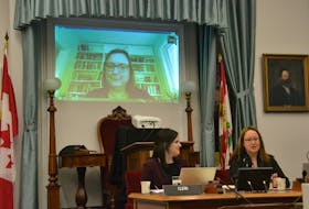 Researcher Evelyn Forget speaks before a meeting of the special committee on poverty at the Coles Building recently, presided over by clerk assistant Emily Doiron and committee chairwoman Trish Altass. The meeting focused on the subject of a basic income guarantee.
Stu Neatby/THE GUARDIAN