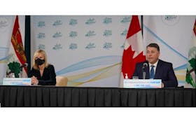 P.E.I.'s chief public health officer Dr. Heather Morrison, left, and Premier Dennis King attend a news conference Monday, Nov. 23, announcing the province would be withdrawing from the Atlantic travel bubble for two weeks from Nov. 24 to Dec. 7.