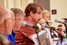 Coun. Gerard Holland, centre, spoke during a Three Rivers special council meeting at Kings Playhouse in Georgetown on Aug. 24.