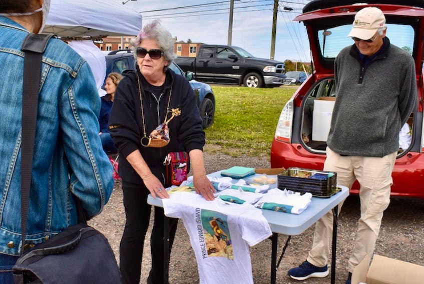 Anne Putnam explains the 25-year-old story of the topless not-Anne T-shirts at the Charlottetown Farmers' Market recently.