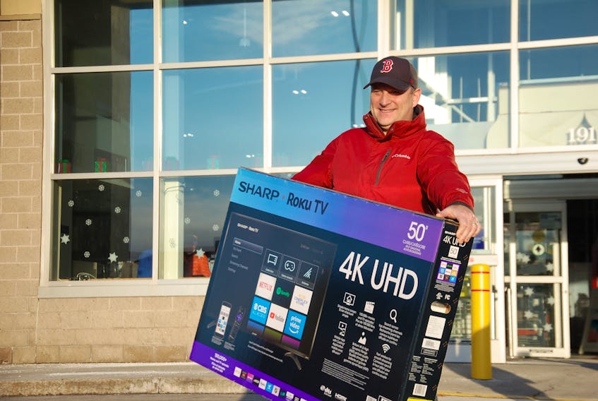 Robin Goss of Charlottetown was pleased with his purchase of a 50-inch screen TV on Boxing Day at Best Buy. - Jim Day