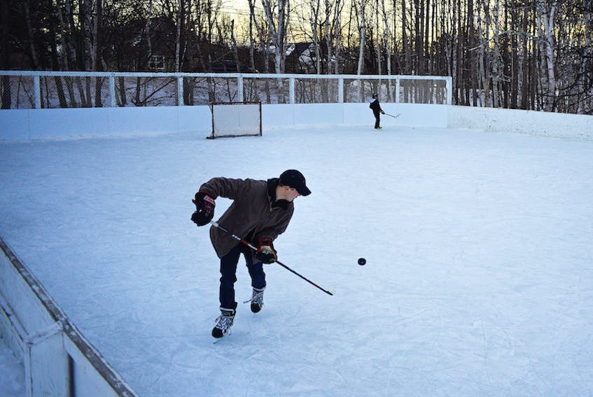 Sam Weeks, 22, practises his puck-handling skills while out for a skate at the Bunbury Outdoor Rink in Stratford on Saturday. A number of people took advantage of the nice weather, which included temperatures around 0 C, to get out and enjoy the February day.