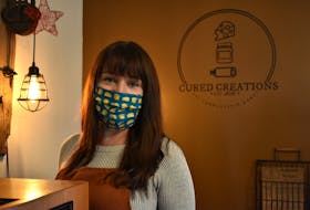Helena Wood, co-owner of Cured Creations, stands behind the counter of her small shop located inside Back Alley Music. She has been reaching out to vendors affected by the cancellation of the Victorian Market and offering up her space for those wanting a pop-up location.