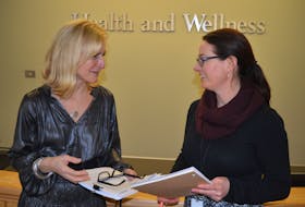 Dr. Heather Morrison, left, P.E.I.’s chief public health officer, talks with Erin Bentley, senior public health policy and planning officer in the Department of Health and Wellness’s communicable disease program on Friday following a media briefing on COVID-19. Morrison said there are no confirmed cases of the coronavirus on P.E.I. and her office in receiving updates five times a week from the national chief public health office.