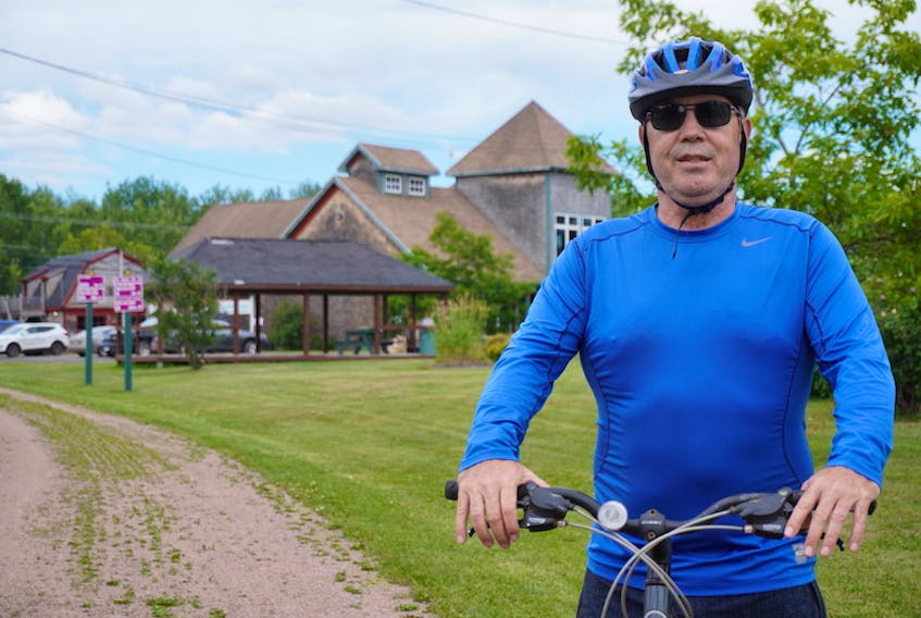 Frank MacEachern pauses in Mount Stewart during a bike ride along the Confederation Trail on July 17.