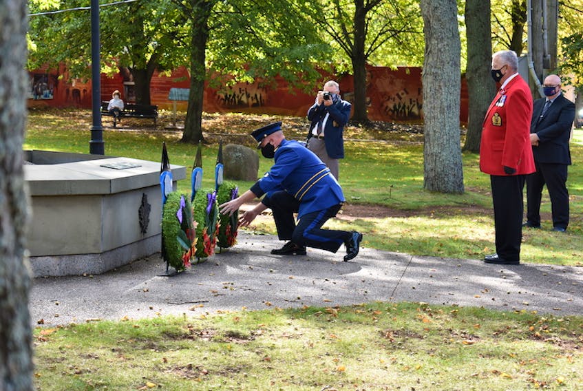 Sgt. Ron MacLean of the Summerside Police Services places one of three wreaths during the Prince Edward Island Police and Peace Officers' Memorial Service on Sunday.