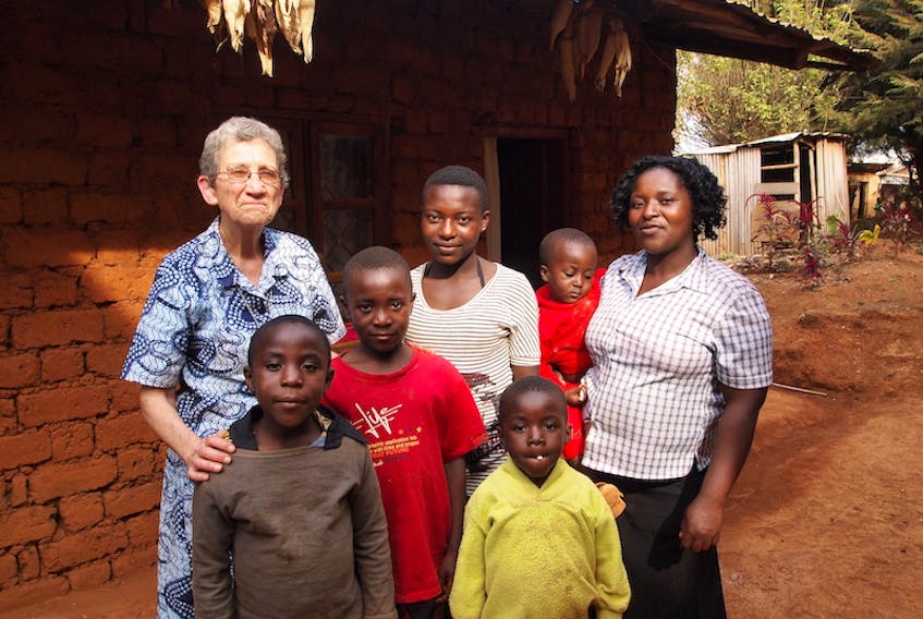 Sister Cecile Buote, a missionary sister and formerly of Rustico, is shown with residents of Cameroon. An online auction to raise money for her work kicks off later this month.