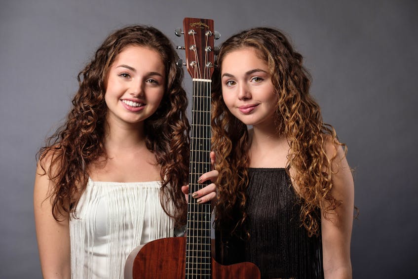 Charlottetown teenage twins Ava, left, and Lily Rashed are pictured performing on the new Nickelodeon reality show “America’s Most Musical Family’’, a segment that was taped in August in Los Angeles. It will air on Friday, Dec. 6 at 8 p.m. AT. The winning act on the show will walk away with a recording contract. - Submitted