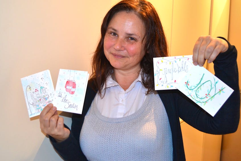 Summerside artist Arlene Giddings shows some the cards she’s created for the 2019 holiday season. Sally Cole/The Guardian