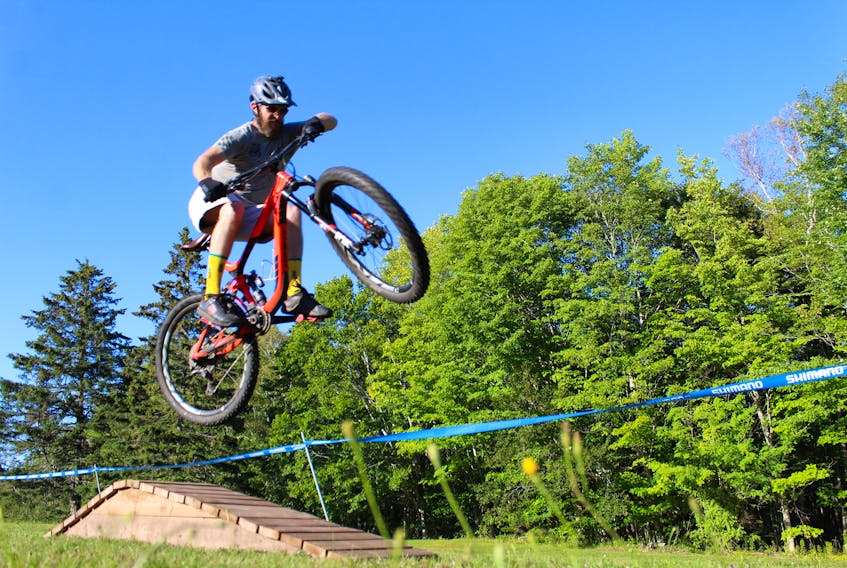 Geoff Murray gets air during Strathaganza Mountain Bike Festival in Strathgartney Provincial Park.