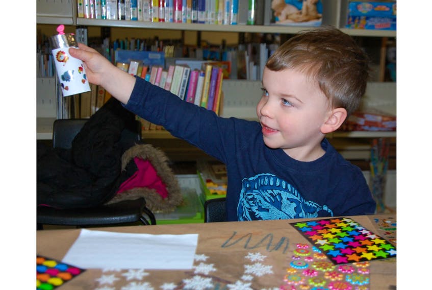 Three-year-old Rye Grandy makes a popper at the Confederation Centre Public Library in Charlottetown. Family Literacy Day is Monday, Jan. 27.