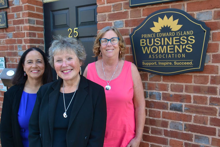 Miriam Briggs, right, Margaret Magner and Cathy Rose of the P.E.I. Business Women’s Association stand outside their office in downtown Charlottetown on July 11. The organization just received $485,000 from a federal government investment.