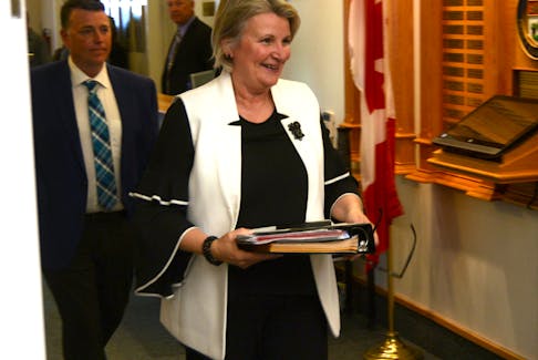 Finance Minister Darlene Compton enters the legislature for a question period earlier this sitting. Compton was asked by Liberal MLAs Tuesday why the province’s budget excluded a $4.9 million rental assistance program that had been a PC campaign promise. MITCH MACDONALD/THE GUARDIAN