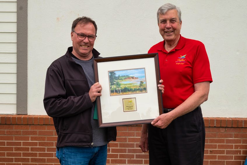 Stratford Mayor Steve Ogden presents Rudi Terstege with the 2019 Gail and Neil MacDonald Volunteer of the Year Award. CONTRIBUTED