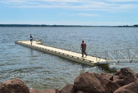 Workers with East Coast Docks put the finishing touches on the floating dock at Victoria Park last year in this file photo. Charlottetown’s parks and recreation committee is recommending the dock become a permanent fixture. Council will likely make its decision at Monday’s regular monthly meeting.