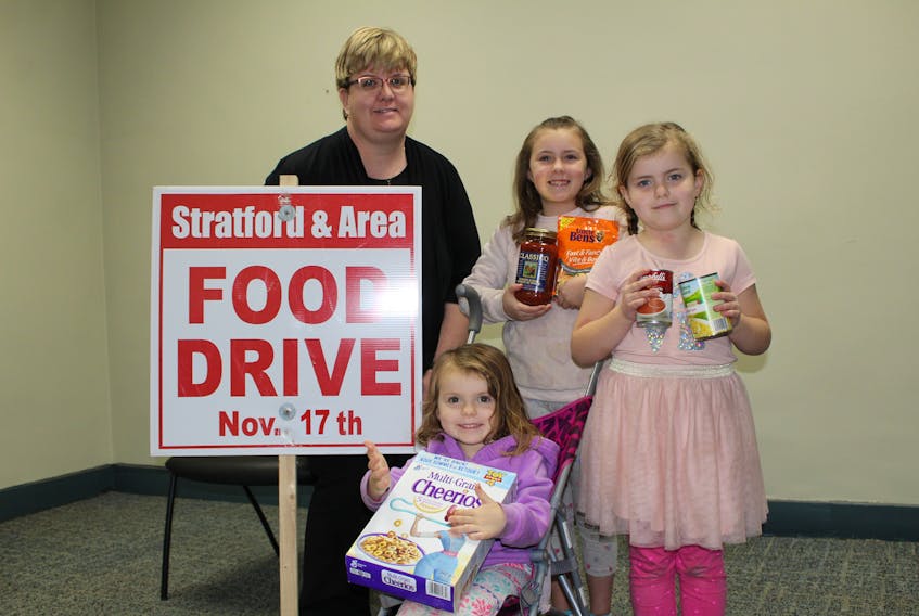 Preparations are underway for the 29th annual Upper Room Food Bank Stratford and Area Food Drive. This year's event will be held on Nov. 17 with door-to-door pickup from 1 p.m. to 3 p.m. The food drive extends as far as the Irving gas station in Hazelbrook to the River Meadows subdivision in Mermaid to Pownal as far as the Gay Road, and areas in between. In this photo are Elaine Fraser, the food drive's coordinator and volunteers Lydia Spidel, 8, right, Elsa Spidel, 5, and in the stroller is three-year-old Nora Spidel.