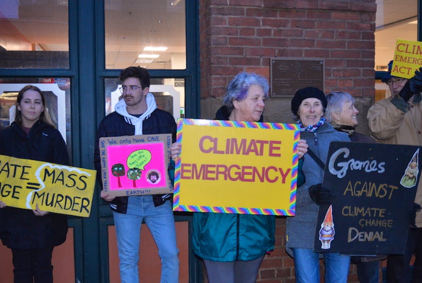 Climate demonstrators stand on the sidewalk in front of Charlottetown City Hall in this Guardian file photo. A recent poll reveals most Canadians want government to stay focussed on climate despite the pandemic.