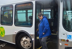 T3 Transit drops off a passenger in downtown Charlottetown on Monday. Mike Cassidy, who manages the services for the capital area municipalities, says the service is breaking daily records this month, to the point where buses have been added to some routes.