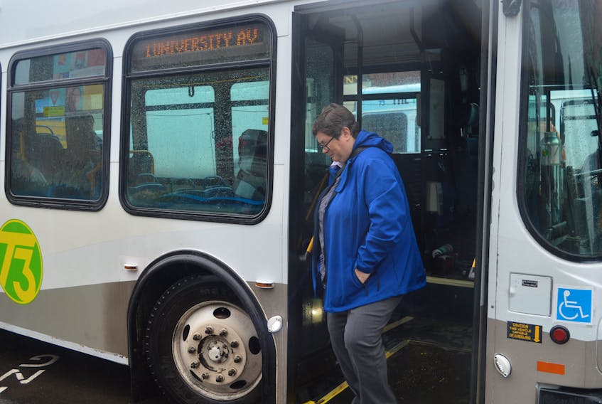 T3 Transit drops off a passenger in downtown Charlottetown on Monday. Mike Cassidy, who manages the services for the capital area municipalities, says the service is breaking daily records this month, to the point where buses have been added to some routes.