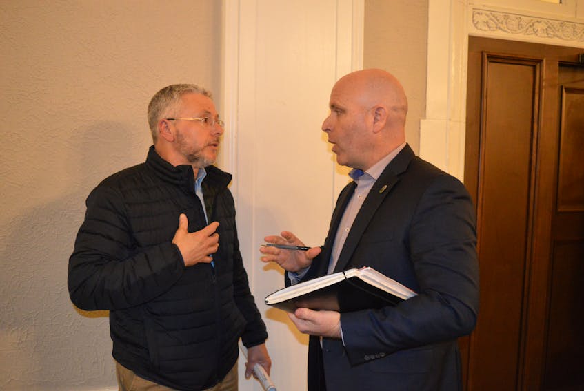 Peter Poirier, left, was one of about a dozen residents who spoke out against a proposed 41-unit apartment building on Pine Drive in Charlottetown. Coun. Greg Rivard, chairman of the planning and heritage committee, says they will discuss the matter further at their next committee meeting and council could render a decision at its monthly public meeting in March.