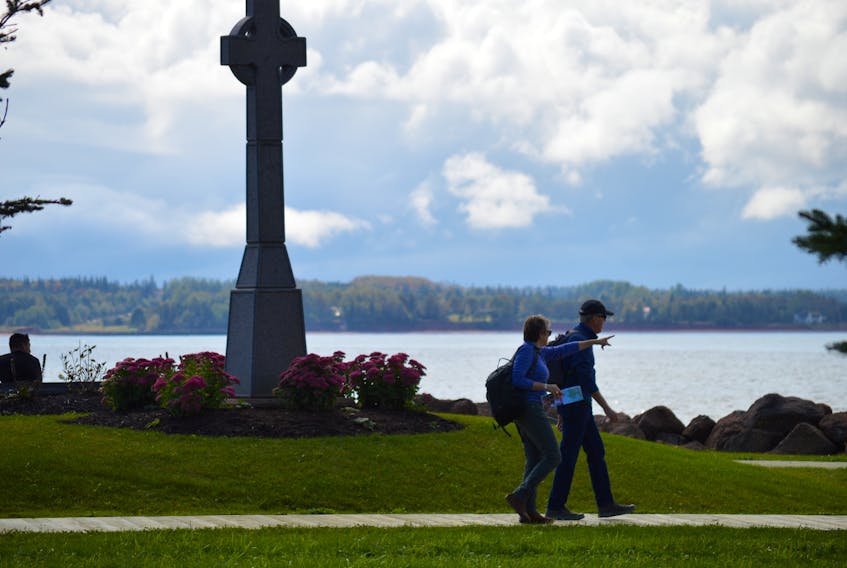 People enjoy a stroll and the view off the Charlottetown boardwalk Wednesday between the Irish monument and Paoli’s Wharf (behind the Queen Charlotte Armouries). The city’s parks and recreation committee has recommended replacing that section of the boardwalk at a cost of $118,000. The project has received council approval.