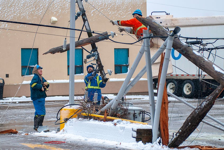 Electric company crews repair downed power poles, a transformer and lines on Eden Street in Charlottetown Thursday November 29, 2018 as a power storm hits Prince Edward Island. Winds gusting to 100 km/h along with snow and rain has knocked power out to more than 40,000 Maritime Electric customers as of mid-afternoon. High tides and surf is causing damage along the north shore of the province. -Brian McInnis/Special to The Guardian
