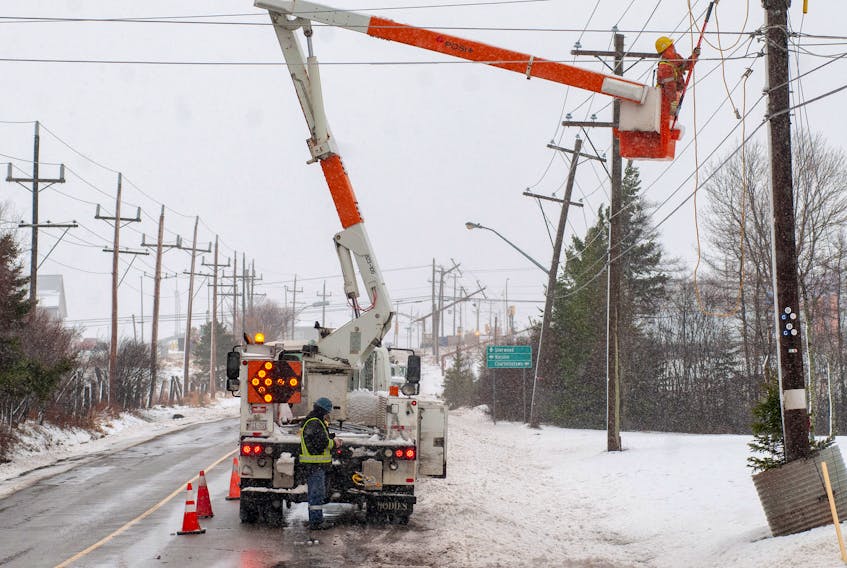 Power company crews repair poles on a stretch of road near Charlottetown Thursday November 29, 2018 as a major storm hits the provionce. Five poles were downed on this short stretch of road as winds gusting to 100 km/h hit. The storm also brought snow and rain and has knocked power out to more than 40,000 Maritime Electric customers as of mid-afternoon. High tides and surf is causing damage along the north shore of the province. -Brian McInnis/Special to The Guardian