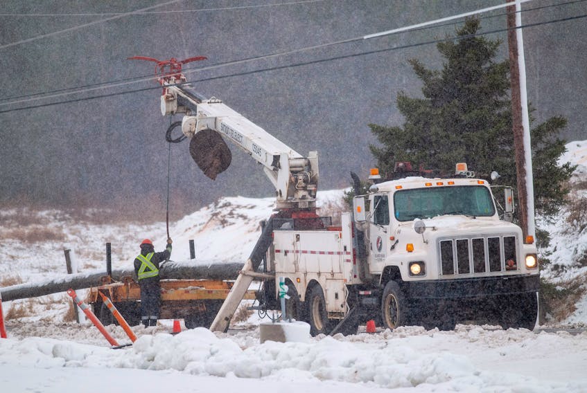 Power company crews repair poles on a stretch of road near Charlottetown Thursday November 29, 2018 as a major storm hits the provionce. Five poles were downed on this short stretch of road as winds gusting to 100 km/h hit. The storm also brought snow and rain and has knocked power out to more than 40,000 40,000 Maritime Electric customers as of mid-afternoon. High tides and surf is causing damage along the north shore of the province.  -Brian McInnis/Special to The Guardian