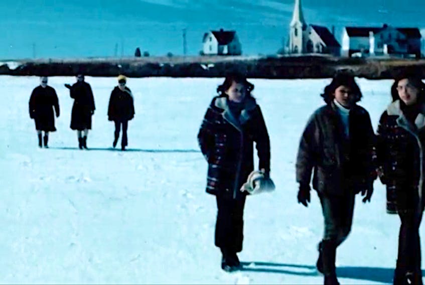 This is a screenshot of the Beneath the Path of Crows music video, showing the historical ice walk that the Mi'kmaq people of Lennox Island would have had to do before the causeway was built in 1973.